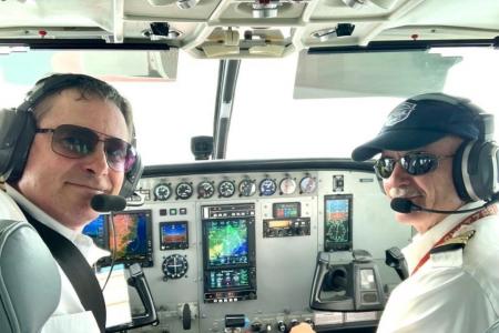 Pilots Roy Rissanen and Emil Kundig in the cockpit