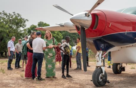 People gathered around the plane in Guinea