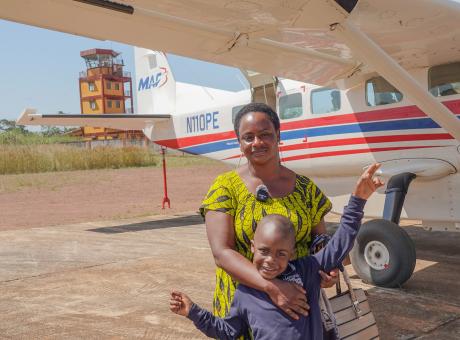 Yolande Holie and her son André Haba ready for the flight from Nzerekore to Conakry.